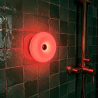 Auria Halo glowing deep red on green zellige tile