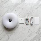 What is in the box: Auria Halo, wall plate, remote, USB-C cable