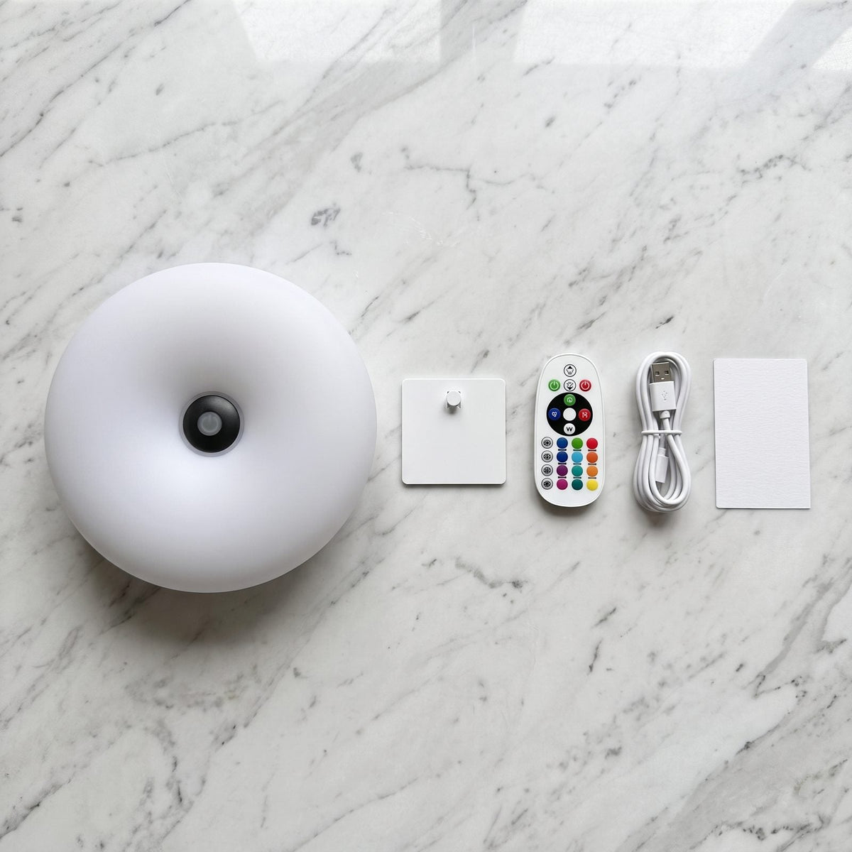 What is in the box: Auria Halo, wall plate, remote, USB-C cable